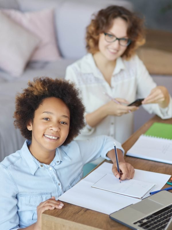 radiate-happiness-happy-mixed-race-teen-schoolgirl-smiling-at-camera-while-having-a-lesson-with.jpg